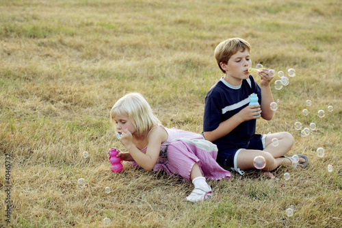 Photo: Children blowing bubbles Children blowing bubbles
