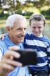 Grandfather and grandson taking picture together