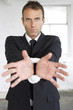 Businessman with his wrist tied up