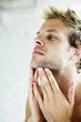 Man applying aftershave