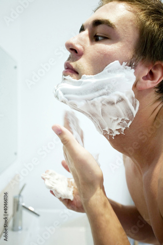 Photo: Man applying shaving cream on his face Man applying shaving cream on his face