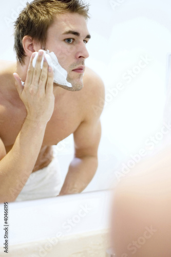 Photo: Man applying shaving cream on his face Man applying shaving cream on his face