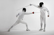 Two men fencing