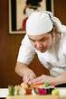 Chef cutting sushi