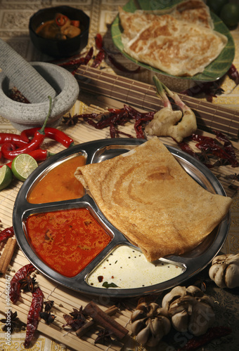Foto: Thosai and roti canai in the background Thosai and roti canai in the background