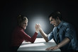 Business people arm wrestling