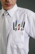 Mini sized businessman trying to get out from businessman's pocket