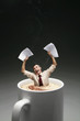 Businessman drowning in a cup of coffee