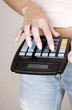 Woman calculating with a calculator.