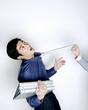 Photo: Businesswoman pulling businessman's tie Businesswoman pulling businessman's tie