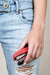 Woman in jeans holding a stapler
