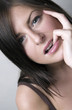 Foto: Woman biting her finger Woman biting her finger