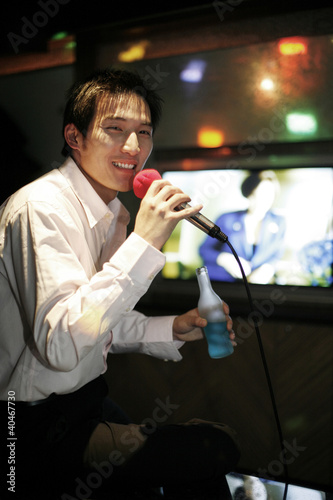 Photo: Businessman singing karaoke Businessman singing karaoke