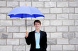 Photo: Businessman holding an umbrella Businessman holding an umbrella