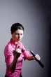 Businesswoman holding a nunchaku inviting people for a challenge