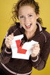 Woman tearing her L sticker