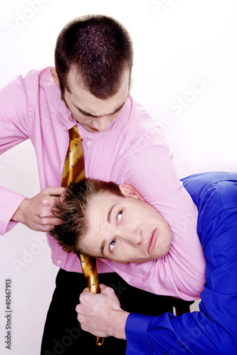 Photo: Businessman bullying his colleague Businessman bullying his colleague