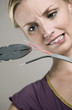 Woman cutting wire with plier