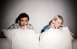 Couple watching horror movie on the bed