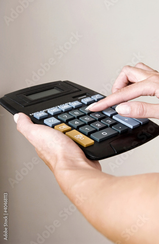 Photo: Making calculation with calculator Making calculation with calculator