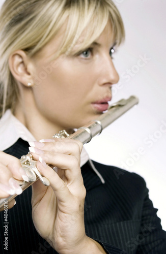 Photo: Woman playing flute Woman playing flute