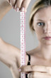 Woman using measuring tape