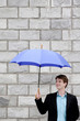 Photo: Businessman holding an umbrella Businessman holding an umbrella