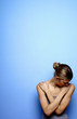 Woman with her hands covering her body