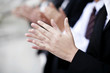 Business people clapping hands