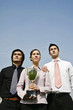 Business people with their winning trophy