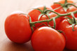 Fresh tomatoes on wooden surface Fresh tomatoes on wooden surface