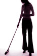 Businesswoman sweeping the floor