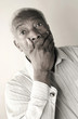Senior man in shock covering his mouth