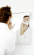 Man applying shaving cream on his face