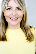 A portrait of a lady wearing yellow singlet
