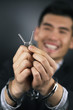 Handcuffed businessman with keys