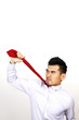 Businessman pulling his tie