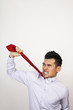 Businessman pulling his tie