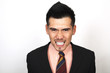 Angry businessman clenching teeth