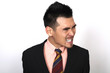 Angry businessman clenching teeth