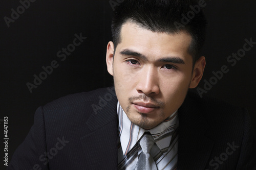 Photo: Businessman looking at the camera Businessman looking at the camera