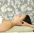 Foto: Woman enjoying a head massage Woman enjoying a head massage