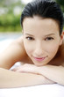 Woman lying forward on massage table