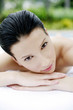 Woman lying forward on massage table