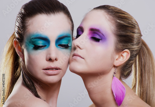 Photo: young beautiful woman with an extreme colorfull make up portrait young beautiful woman with an extreme colorfull make up portrait