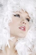 Young woman with white feathers posing for the camera