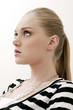 Young woman thinking while looking up