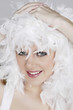 Young woman with white feathers posing for the camera