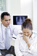 Doctor consulting patient