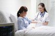 Female doctor cleaning her patient's arm before an injection